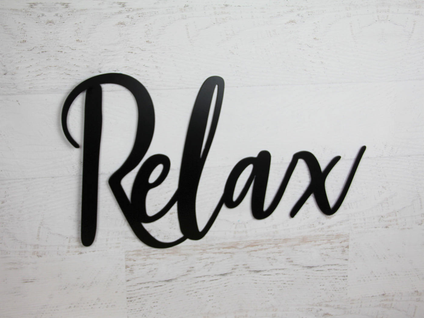 Relax Metal Word Sign - Madison Iron and Wood - Wall Art - metal outdoor decor - Steel deocrations - american made products - veteran owned business products - fencing decorations - fencing supplies - custom wall decorations - personalized wall signs - steel - decorative post caps - steel post caps - metal post caps - brackets - structural brackets - home improvement - easter - easter decorations - easter gift - easter yard decor