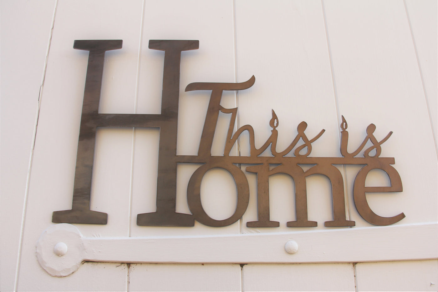 This is Home Metal Word Sign - Madison Iron and Wood - Metal Art - metal outdoor decor - Steel deocrations - american made products - veteran owned business products - fencing decorations - fencing supplies - custom wall decorations - personalized wall signs - steel - decorative post caps - steel post caps - metal post caps - brackets - structural brackets - home improvement - easter - easter decorations - easter gift - easter yard decor